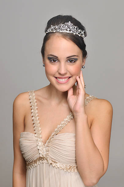 Lovely young woman with party dress Portrait of lovely prom queen. prom queen stock pictures, royalty-free photos & images