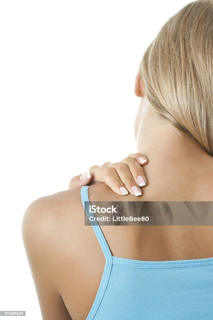 Pain in back Young woman having pain in the back and neck Adult Stock Photo