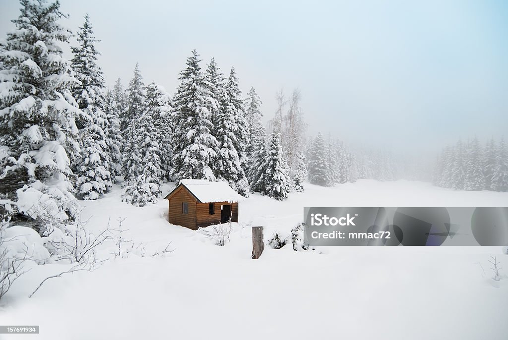 Winter Shack in Snowy Landscape winter shack Log Cabin Stock Photo