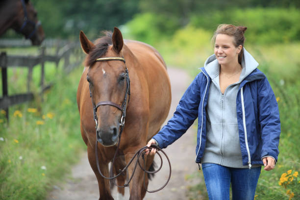 istock Rider walking her horse 157692096