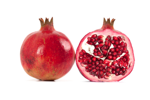 Piece of Fresh ripe pomegranate isolated