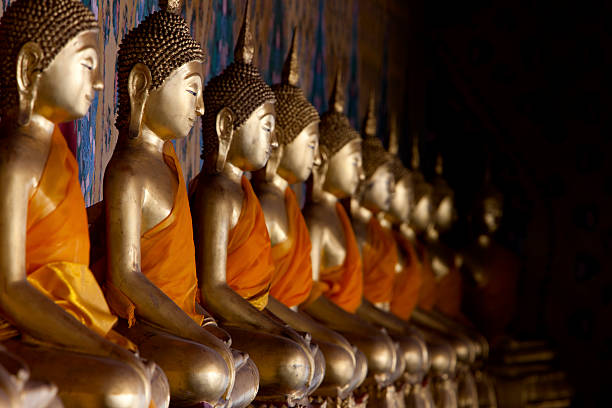 istock Buddha images at Wat Arun, Bangkok, Thailand. 157692585
