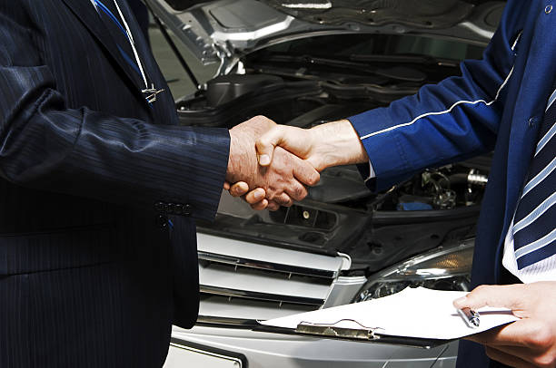 Handshake Men shaking their hands after a good cooperation used cars stock pictures, royalty-free photos & images