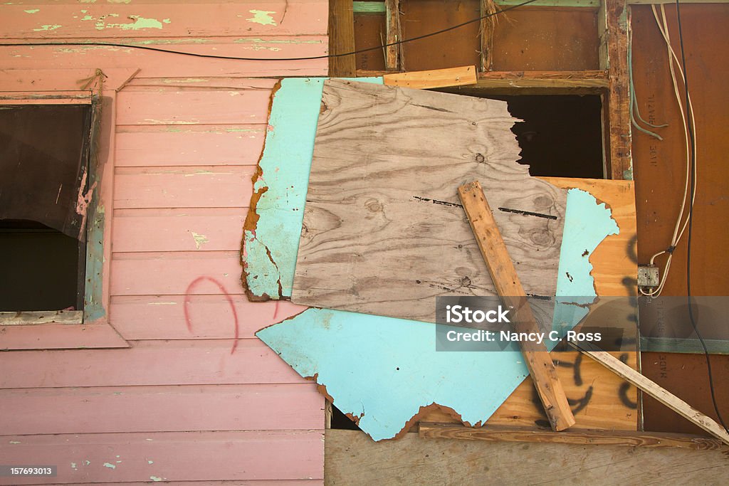 Caribbean Home Boarded Up After Hurricane To Repair Damage Pastel Caribbean home boarded up after Hurricane Ike damage. Boarded Up Stock Photo