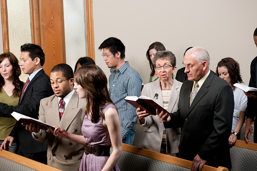 A diverse church congregation worshipping together - Buy credits