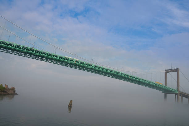 istock Bridge in mist with trucks on the way 157693273