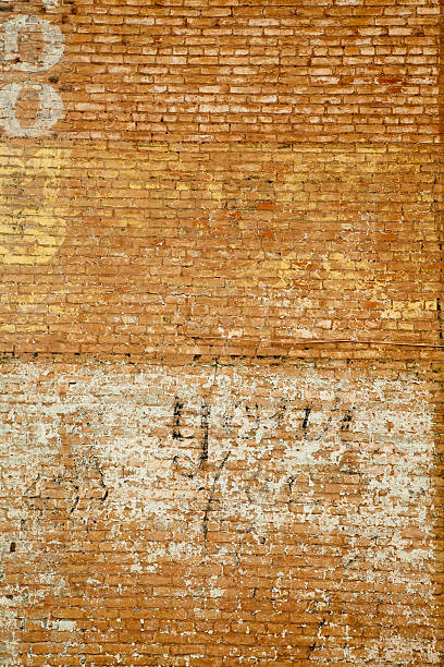 istock Brick Wall With Fading Painted Signs, Grunge 157693661