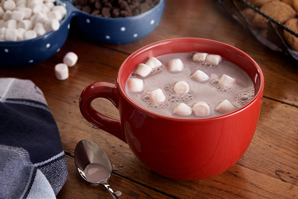Mug of Hot Chocolate and Marshmallows A steamy hot cup of hot chocolate with marshmallows. hot chocolate photos stock pictures, royalty-free photos & images