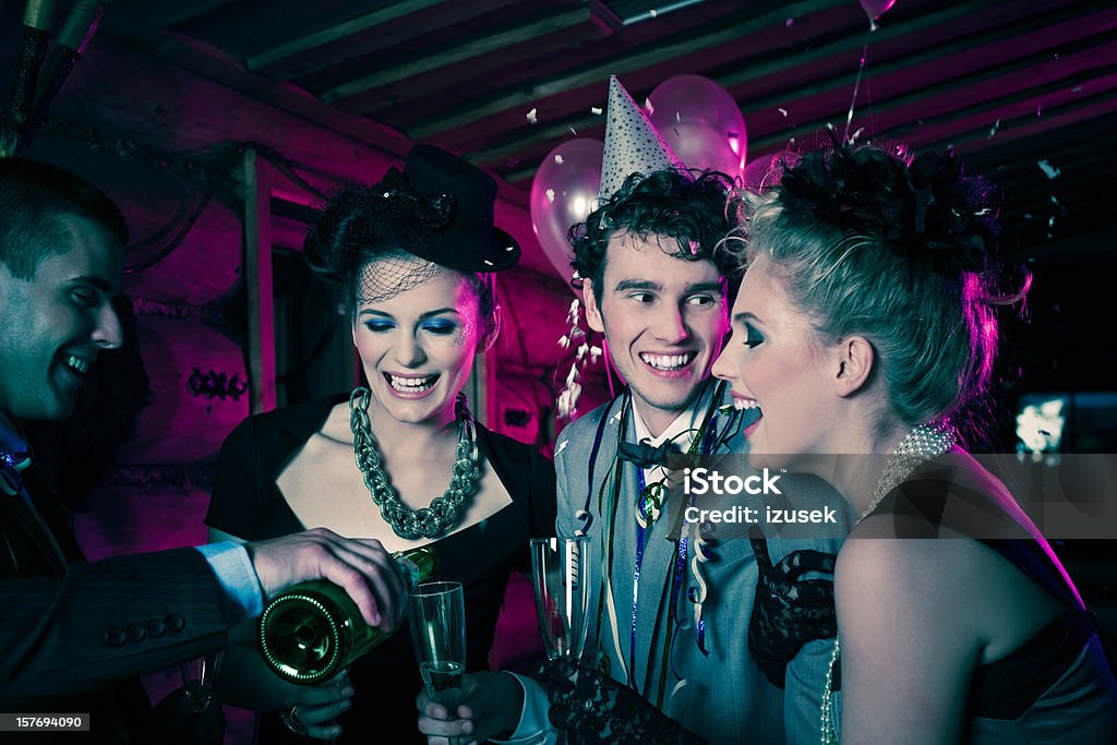 Smiling people enjoying a festive New Year's Eve  Champagne Stock Photo
