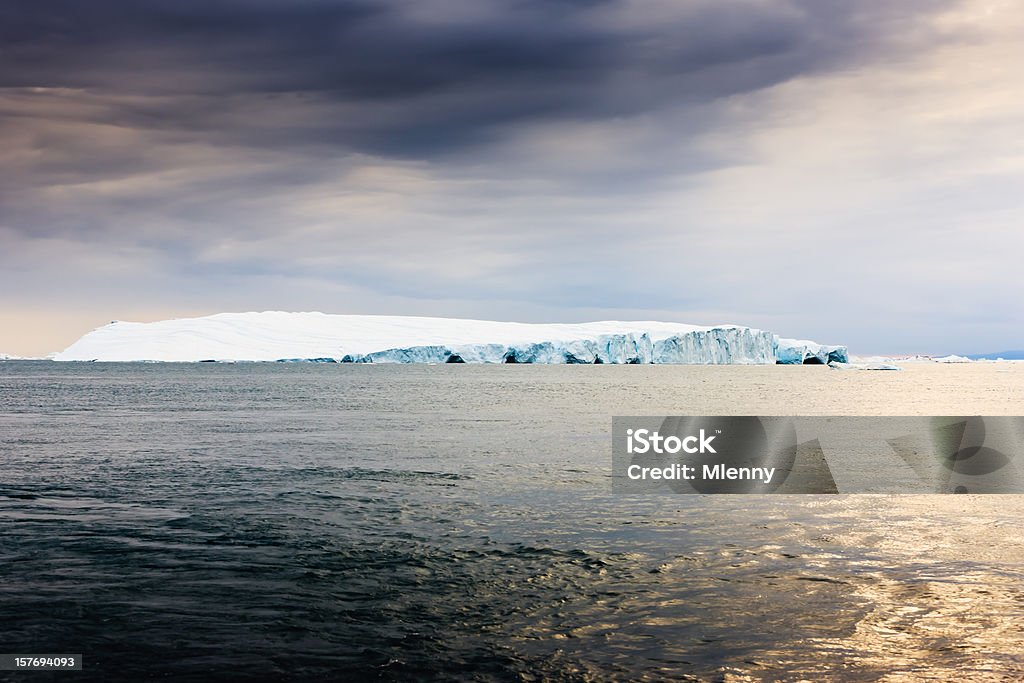 Arctic Iceberg Greenland Huge Icebergs drifting in polar arctic icefjord at the west greenland coast. Ilulissat Icefjord, Greenland, North West Coast. Horizon Stock Photo