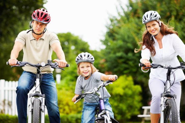 istock Little boy with his parents riding bicycle 157694144