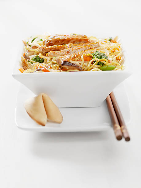 Pork and Vegetable Stirfry with Noodles  cooked selective focus vertical pasta stock pictures, royalty-free photos & images