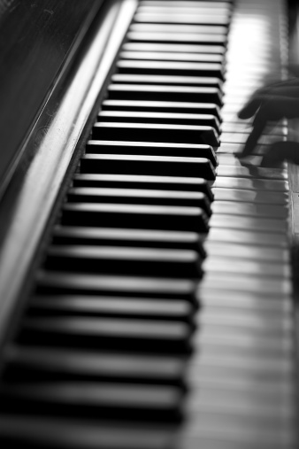 Musician play piano in daylight. Back Lit. Selective focus. http://www.massimomerlini.it/is/music.jpg http://www.massimomerlini.it/is/black&white.jpg