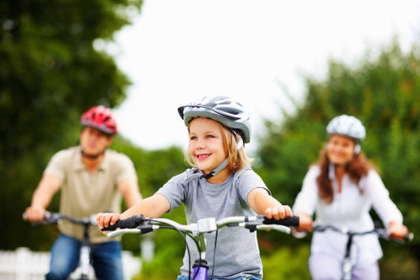 istock Smiling little boy with his parent in background riding bicycles 157694397