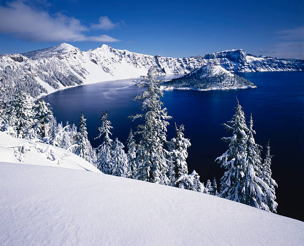 Winter At Crater Lake National Park, Oregon Fresh Snow Glistens On The Rim Of Crater Lake National Park, Oregon cascade range photos stock pictures, royalty-free photos & images