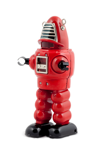 Red metal toy robot isolated
