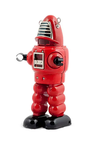 Photo of Red metal toy robot isolated