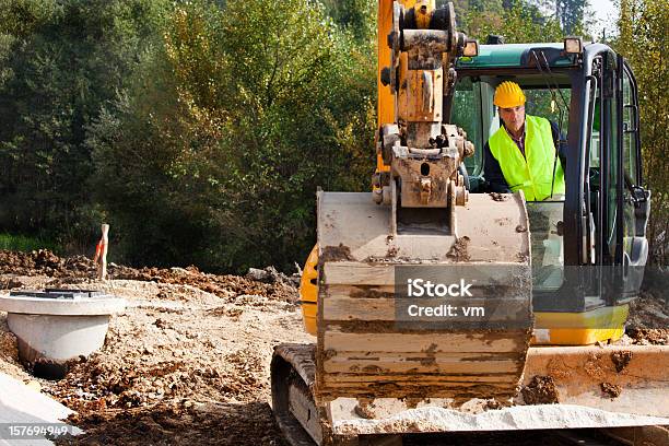 Excavator Driver On A Construction Site Stock Photo - Download Image Now - Backhoe, Construction Worker, Construction Industry