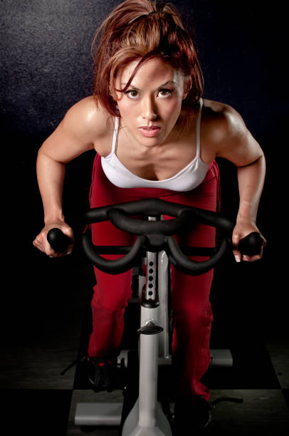 istock Exercising on gym bike 157695305