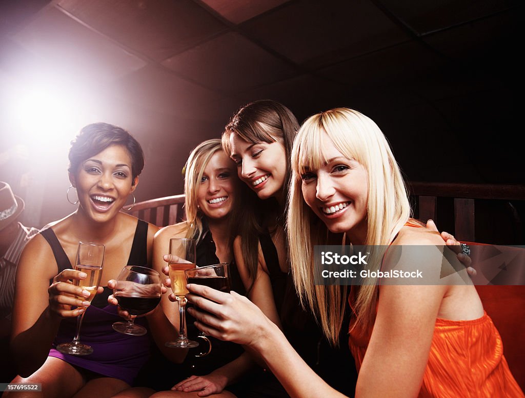 Night club - Smiling young female friends enjoying drinks Night club - Group of smiling young female friends enjoying drinks 20-29 Years Stock Photo