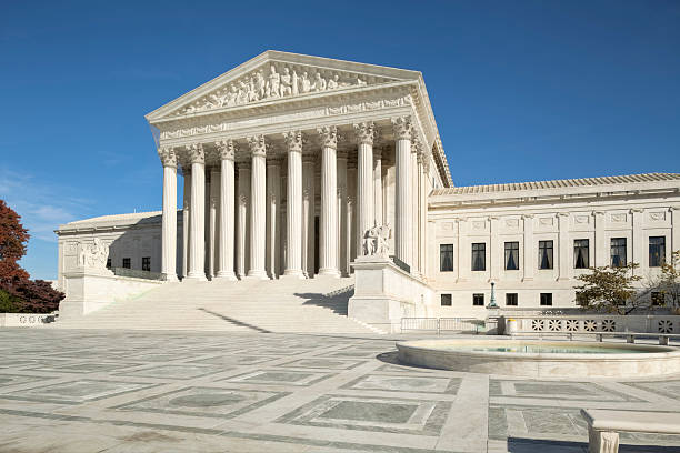 U.S. Supreme Court With Ornate Brickwork and Fountain The United States Supreme Court Building. us supreme court building stock pictures, royalty-free photos & images