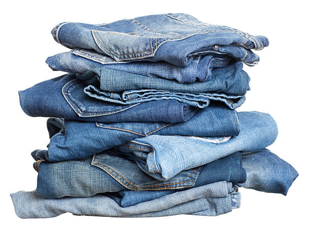 Heap of jeans before laundry. stock photo