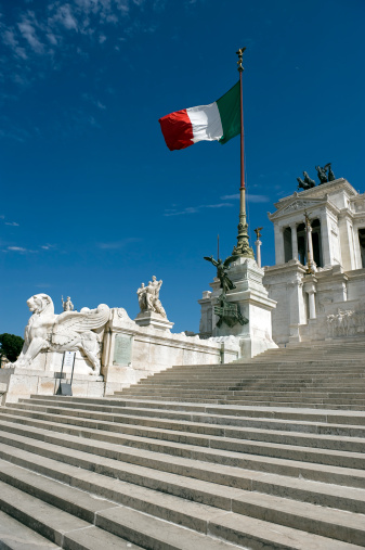 Memorial monument in downtown Rome with italian flag. 