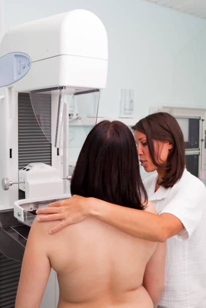 istock Nurse with young women having a mammogram 157696007