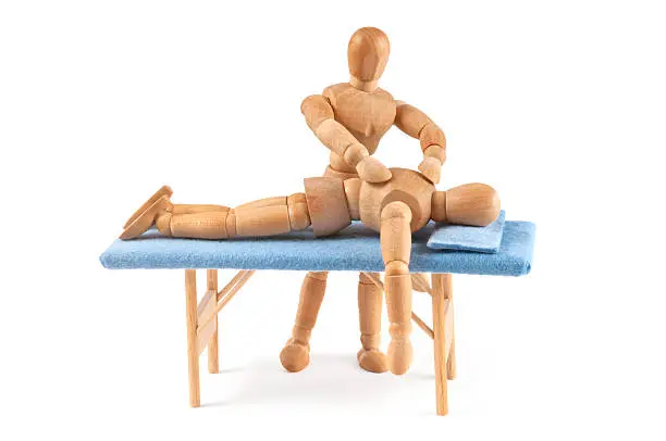 wooden mannequin relaxing and gets a massage by another mannequin. Concept for relaxing, therapie, massage, spa and a lots of more... be creative too :)