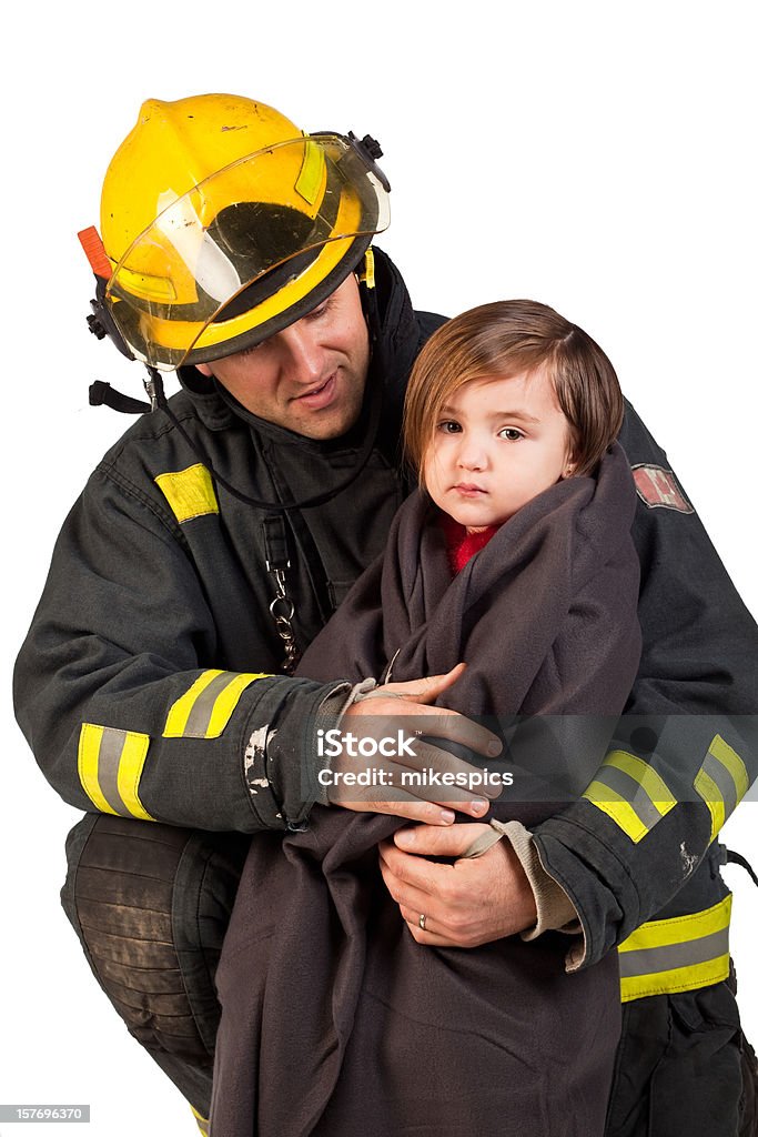 Foto de estudio de una niña sostiene fireman en edredón de pluma. - Foto de stock de Accesorio de cabeza libre de derechos