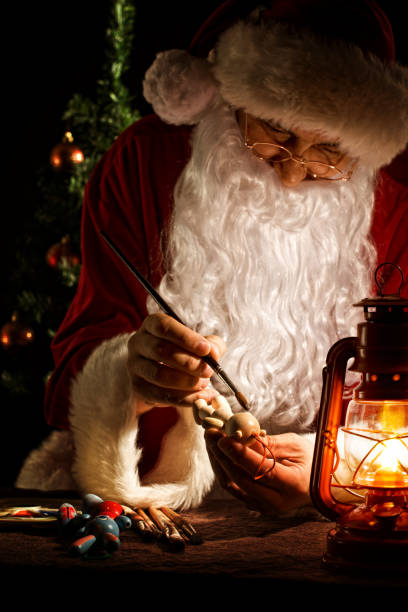 istock Santa Claus painting a toy 157696467