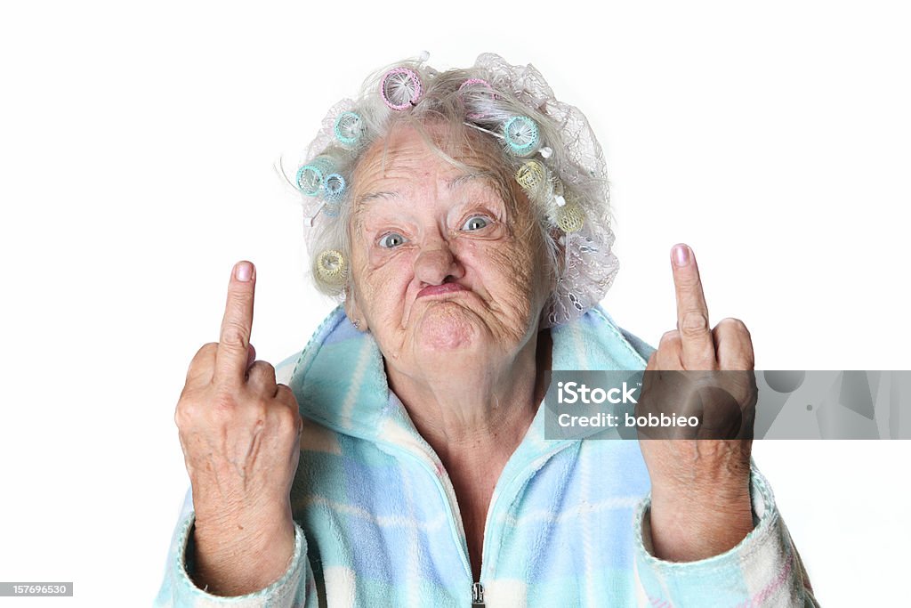 Senior Humor: cranky mujer haciendo caras y cuando se lanza el Ave. - Foto de stock de Raro libre de derechos