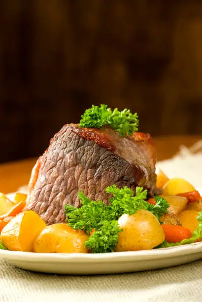 Photo of Pot roast dinner with potoatoes and carrots.