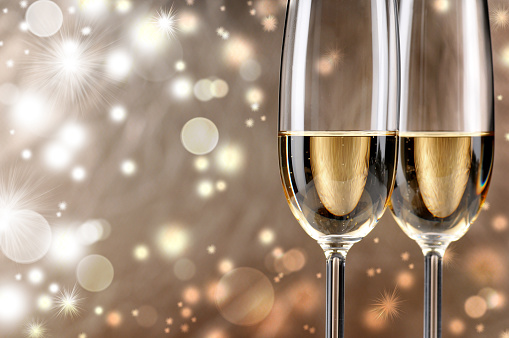 two glasses of champagne on a defocus background