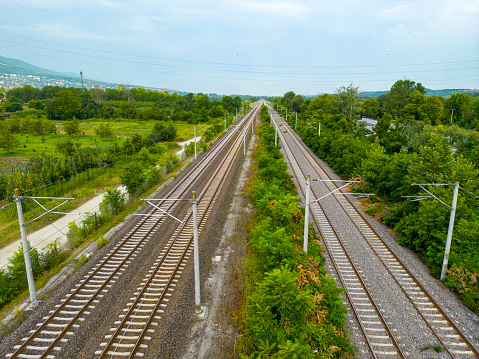 Railway tracks in the park. View from above. Railway line.