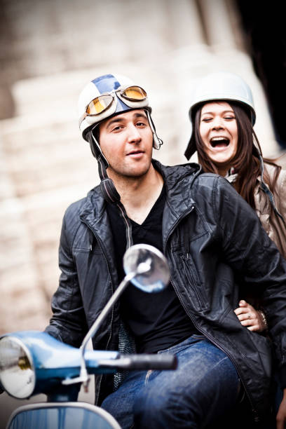 istock Happy couple having fun on scooter 157696818