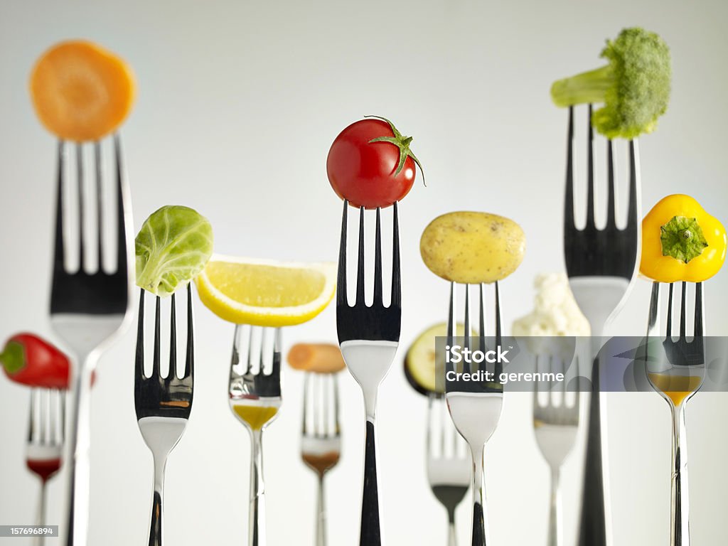 Raw vegetables On Forks Raw foods on forks Antioxidant Stock Photo