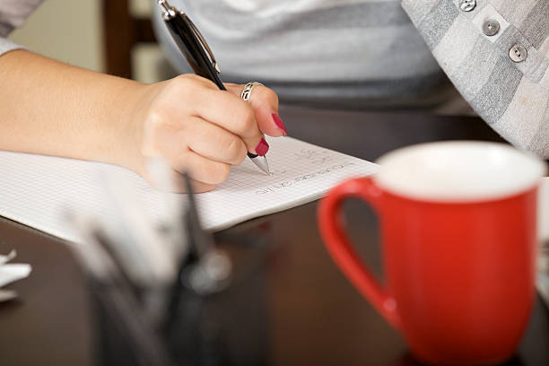 istock Young woman calculating debt 157697156