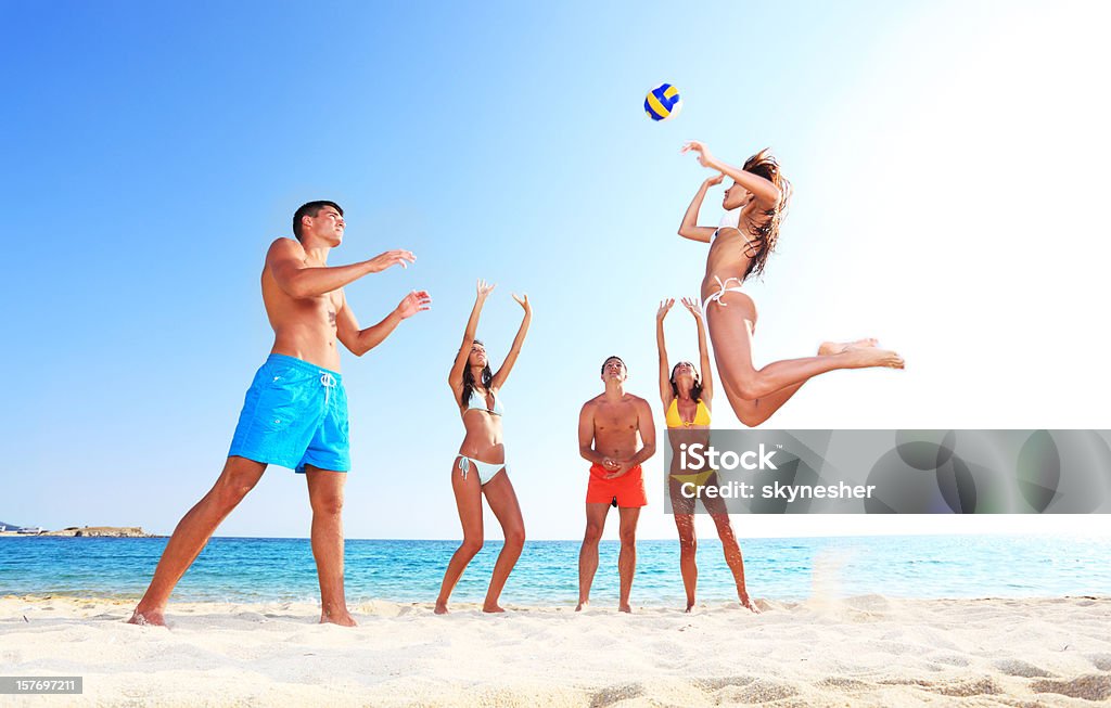 Team plays beach volleyball.  Beach Volleyball Stock Photo