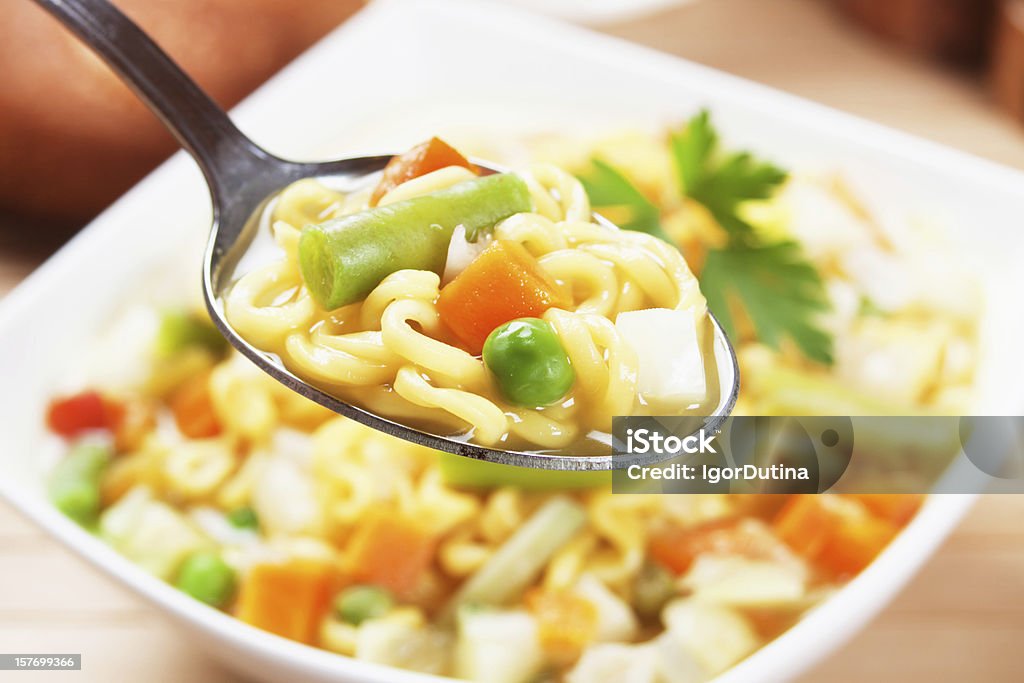 Asian noodle soup with vegetables Asian noodle soup with vegetables in spoon, selective focus Horizontal Stock Photo