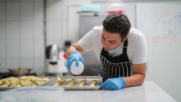 Male chef preparing baked food in commercial kitchen