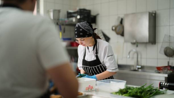 istock Two chefs working and preparing food in commercial kitchen 1577013203