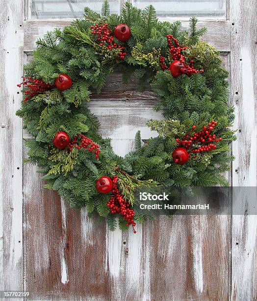 Christmas Wreath Hanging On A Whitewashed Wooden Door Stock Photo - Download Image Now