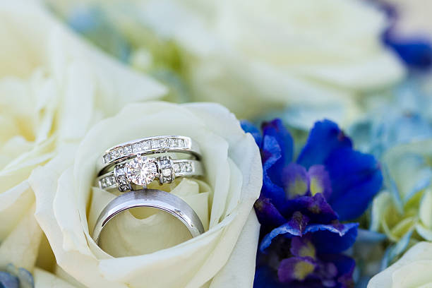 istock Wedding Rings Set Inside a Rose in the Bride's Bouquet 157702203