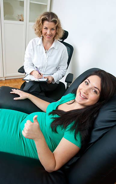 istock pregnant woman and her therapist 157702959