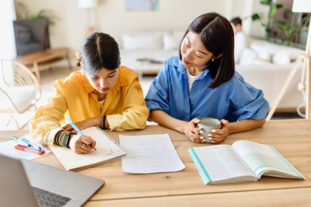 istock Girl doing homework at home 1577059945