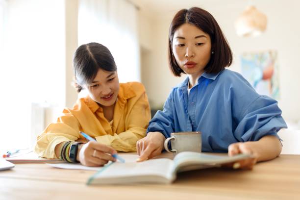 istock A lovely mother helping her daughter with a study project 1577060457