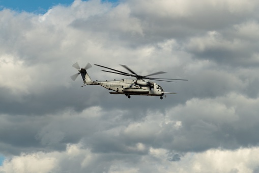 El Centro, United States – March 07, 2023: A U.S. navy marines helicopter flying through the sky on a cloudy day