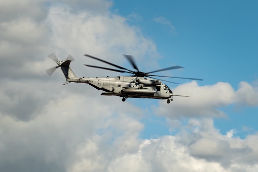 El Centro, United States – March 07, 2023: A U.S. navy marines helicopter flying through the sky on a cloudy day