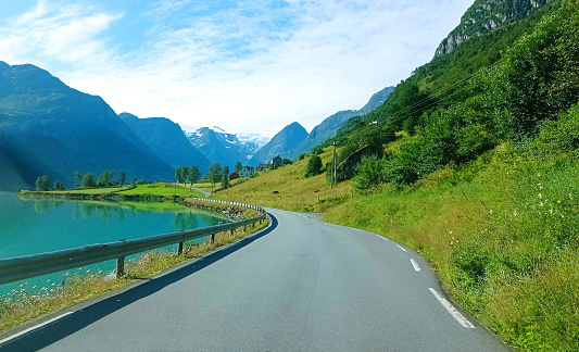 The road in Olden by lake Oldevatnet, Norway.